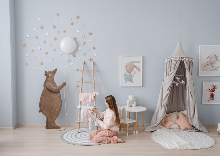 picture of a woman sitting in a baby room