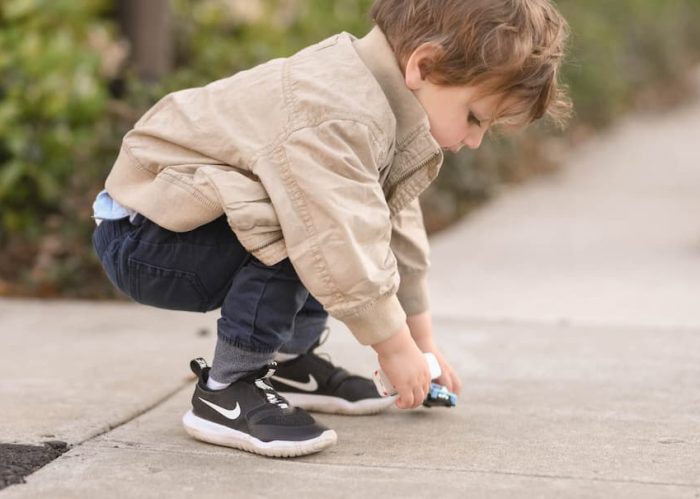 little kid in Nike shoes
