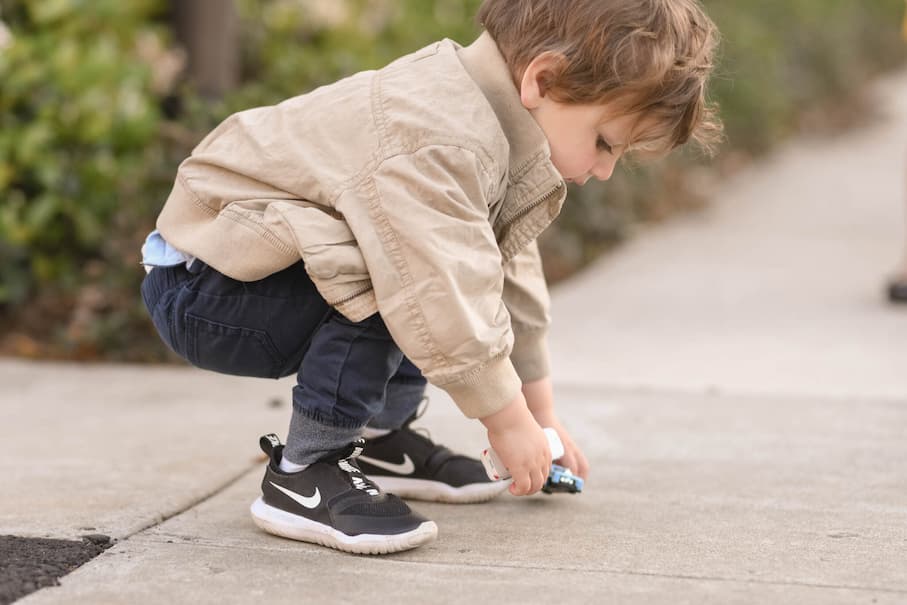 little kid in Nike shoes
