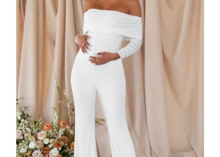pregnant woman wearing white maternity jumpsuit